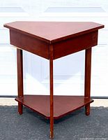 Full front view showing shape, drawer, lower shelf