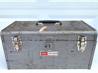 Front view of gray Sears Craftsman toolbox showing handle and latches