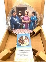 Plate in original box with plastic sleeve and pamphlet