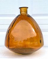 Front view of entire amber-brown glass vase