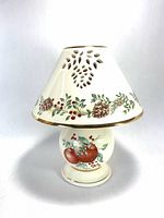 Full view of candle lamp showing base and shade with pattern