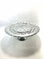 Top view of Lenox metal cake stand showing decorative scroll border and scalloped rim