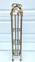 Full view of gold-tone metal 3-tier shelf stand