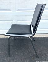 Left side view showing black seat/back and chrome legs