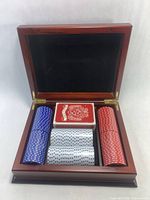 Open case showing chips and one sealed deck