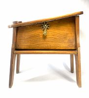 Front view of wooden shoeshine stand closed