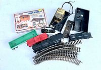 Overview of all items: station kit box, loco, tender, car bodies, power pack, track sections