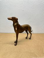 Bronze greyhound sculpture standing profile