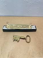 Plaque and key displayed on surface