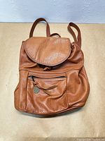 Front view of brown leather backpack
