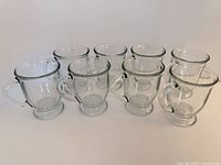 all eight clear glass mugs arranged