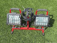 Front view of dual-head Craftsman halogen work light on red base