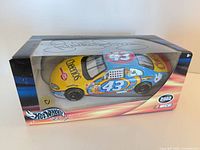 Front and top view of boxed Hot Wheels 1:24 Cheerios #43 car with visible Richard Petty signature
