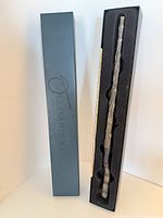 Wand inside original Ollivanders box showing branding and inner foam insert