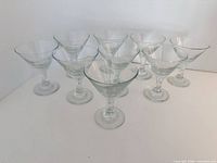 group shot of all eight clear mini martini glasses standing upright