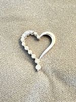 Open heart pendant front view showing diamond side and plain side