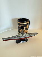 Mug and model ship together