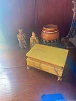 Alabaster trinket box, two carved figurines and Peruvian clay vase group shot