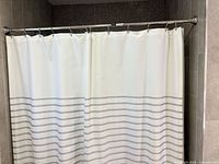 Kate Spade striped shower curtain on rod