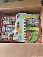 Open box showing magazines and spiral cookbook