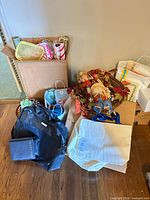 Group of craft and wrapping supplies, wreath, bags and totes