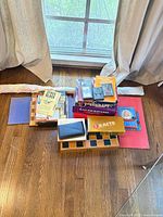 Entire lot grouped on floor by window