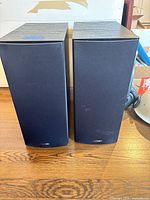 Front view of both Polk Audio speakers with grilles