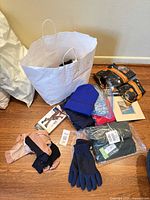 Group shot bag, sweaters, compression socks, gloves