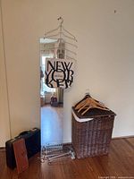 Group shot showing mirror, hamper, hangers, tote, briefcases and metal racks