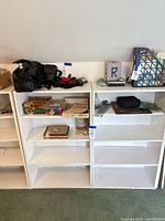 Front view of two white bookcases side by side