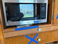 Front view of Panasonic microwave showing door and control panel