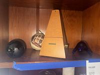 Front view of metronome with surrounding items