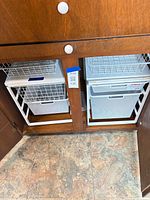 Both Elfa drawer units inside cabinet showing overall condition and configuration