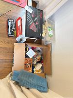 overview of lot showing boxed computer tool kit, socket set, plastic case of hardware, cardboard box of assorted tools