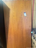 Full view of one door panel showing wood grain and overall size