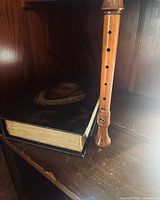 Full view of recorder standing next to closed wooden box