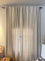 Full set of curtains hung on rod