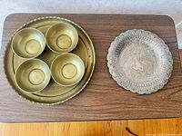 top view of tray with four bowls and separate engraved plate