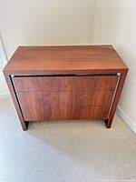 Front view of dresser showing three drawers and overall style