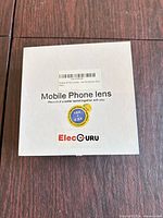 Closed box labeled ElecGURU Mobile Phone Lens 18x 0.6x