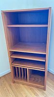 Front view showing overall bookcase, shelves, pull-out trays and record dividers