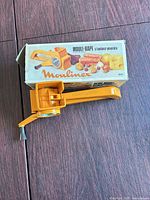 Grater assembled beside original Moulinex box