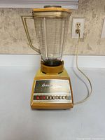 Front view of Osterizer blender showing control panel and overall appearance