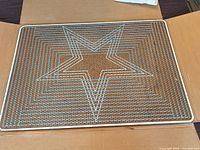 Full view of stretcher board showing star pattern side