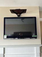Front view of Sharp Aquos 40-inch TV mounted on wall with bracket