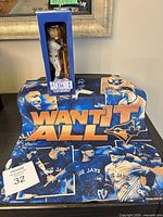 Bobblehead boxed and rally towel laid out