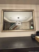 Front view of mounted rectangular mirror, shows overall size and frame color