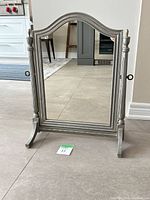 Front view of silver wood tabletop vanity mirror