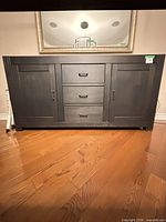 Front view of black sideboard closed