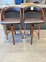 Front view of both walnut swivel counter stools